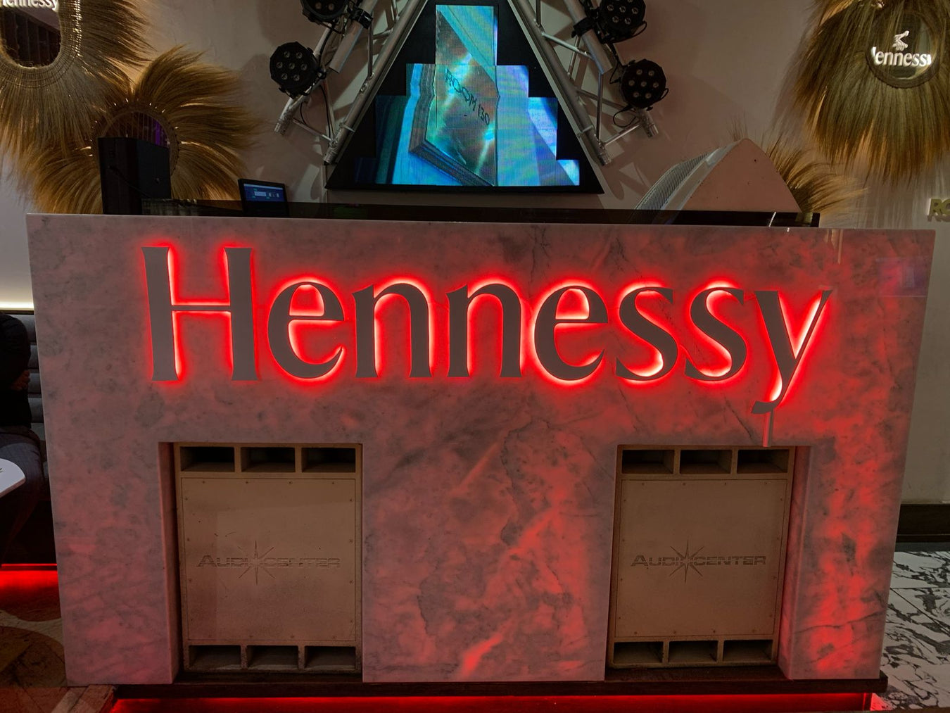 Decorative display with 'Hennessy' branding featuring a fireplace design.