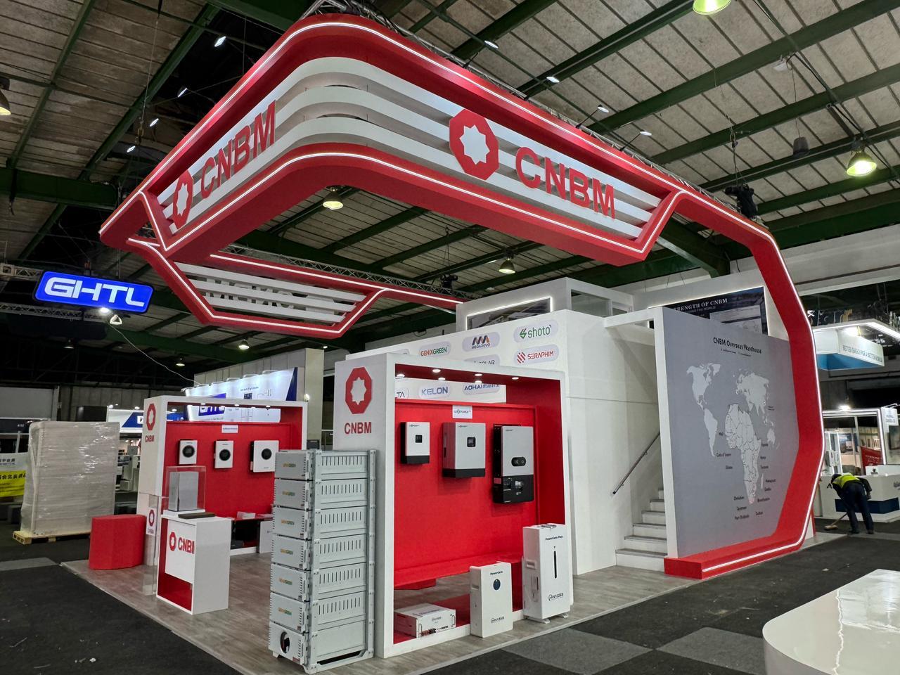 Exhibition stand with led strip branding in a large indoor venue.