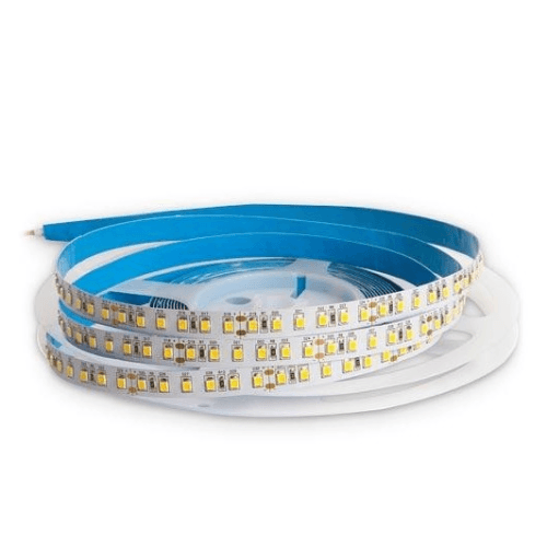 Flexible LED strip light roll with blue adhesive backing on a white spool